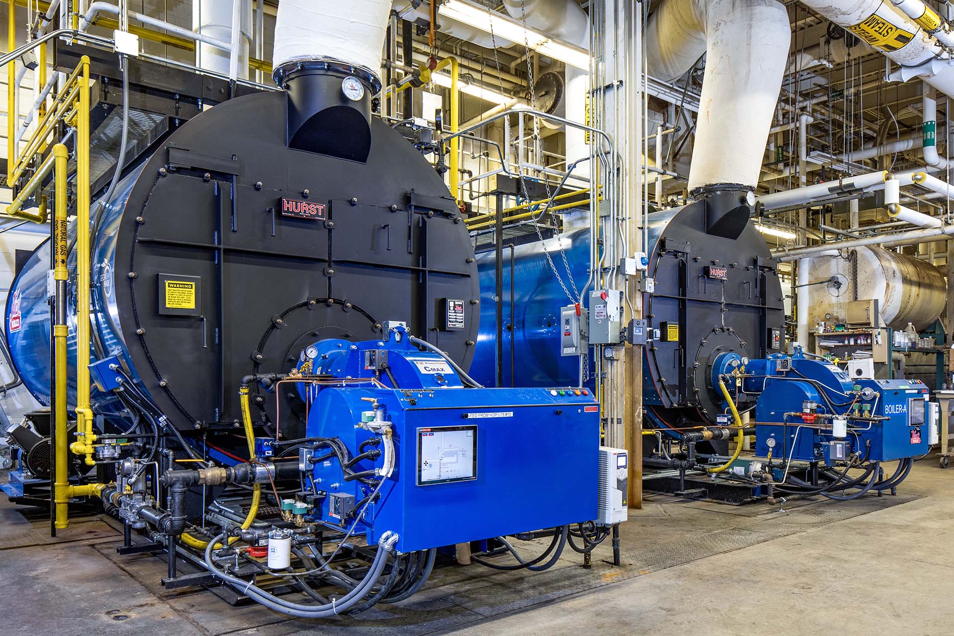 large geothermal system units and piping in aerospace facility