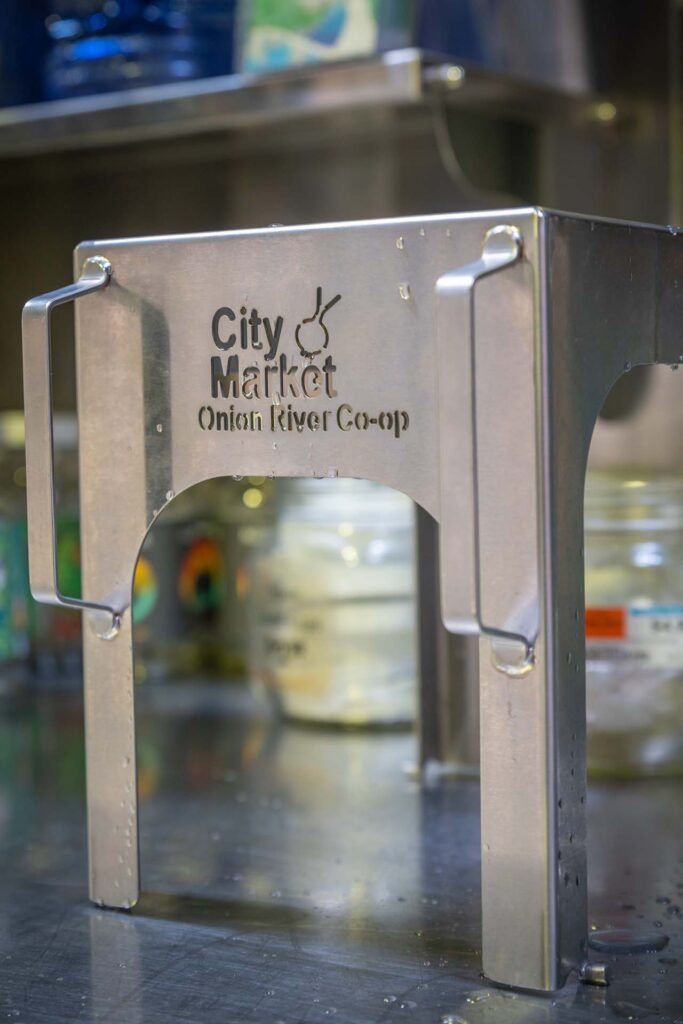 Custom engraving on a stainless steel shelf