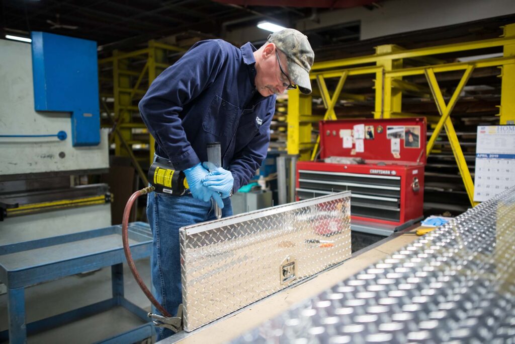 NEAir employee building Diamond Plate Truck Boxes