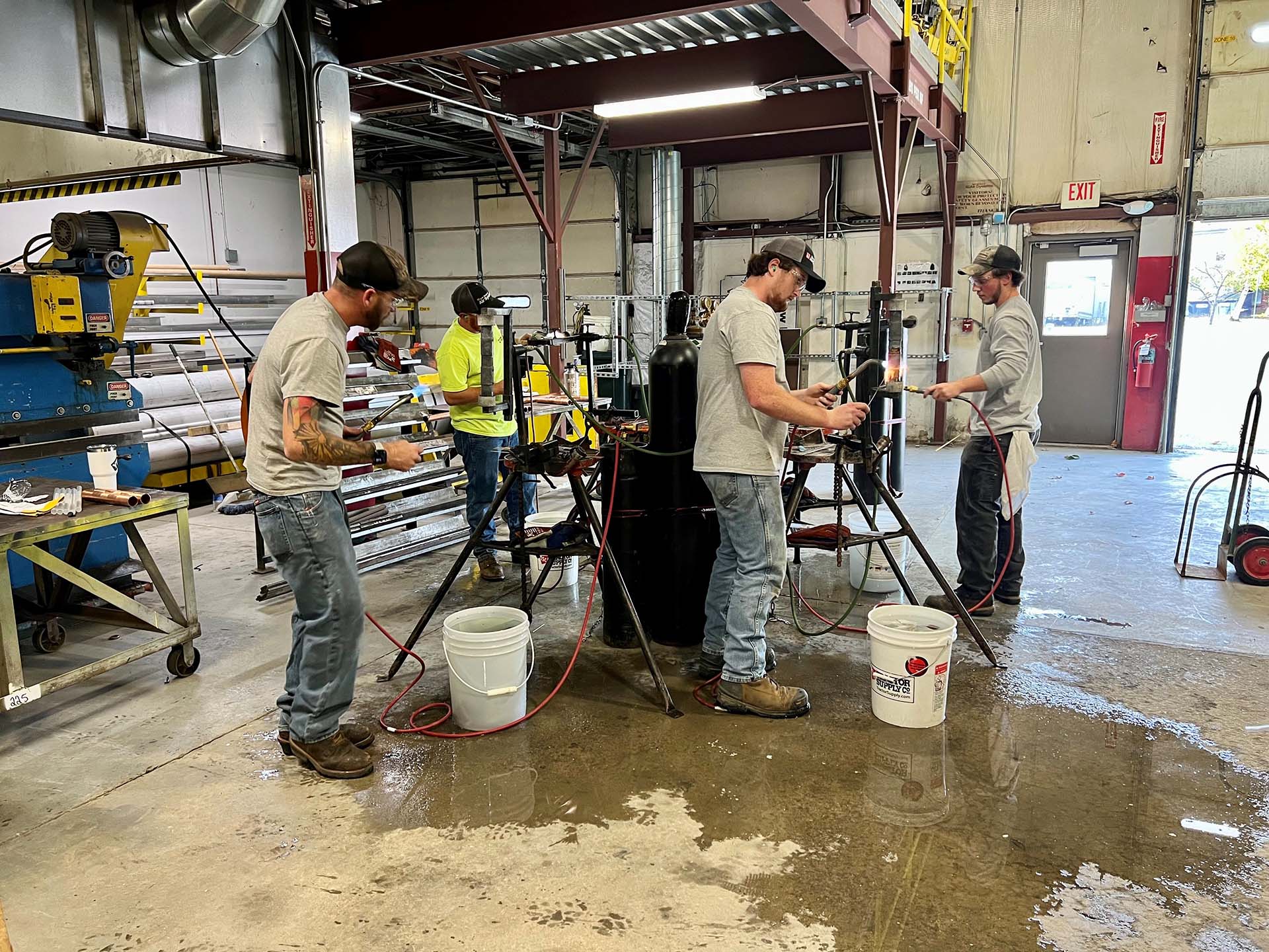 four people taking a medical gas training course