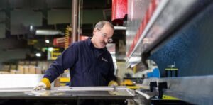 Worker at press brake