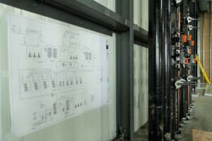 black HVAC system piping in warehouse