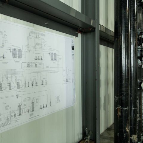 black HVAC system piping in warehouse