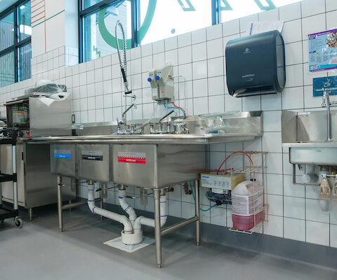 stainless steel bay sink in commercial kitchen at Healthy Living
